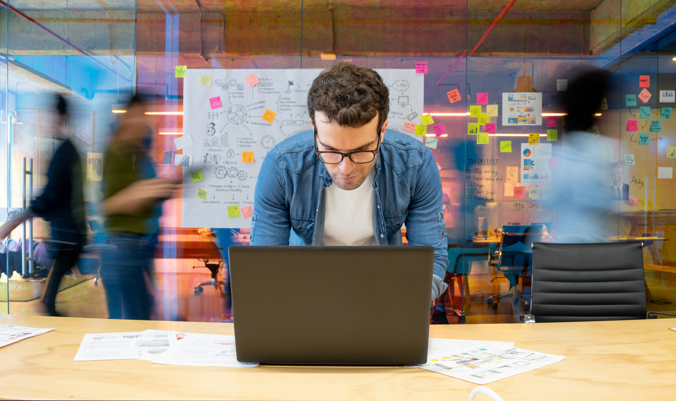 Facebook advertiser working in busy office